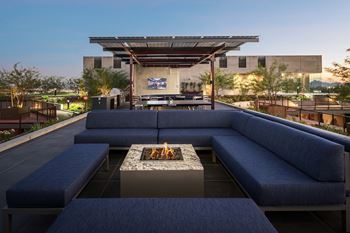 Expansive sundeck with poolside lounge chairs